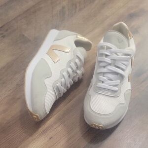 Veja Women's White and Gold Sneakers